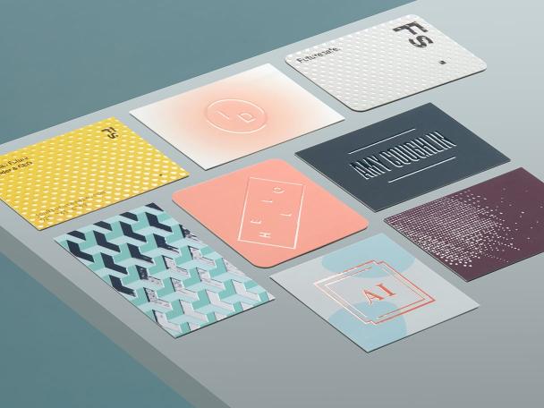 8 Raised Spot UV Business Cards in various sizes, shapes and designs on grey background